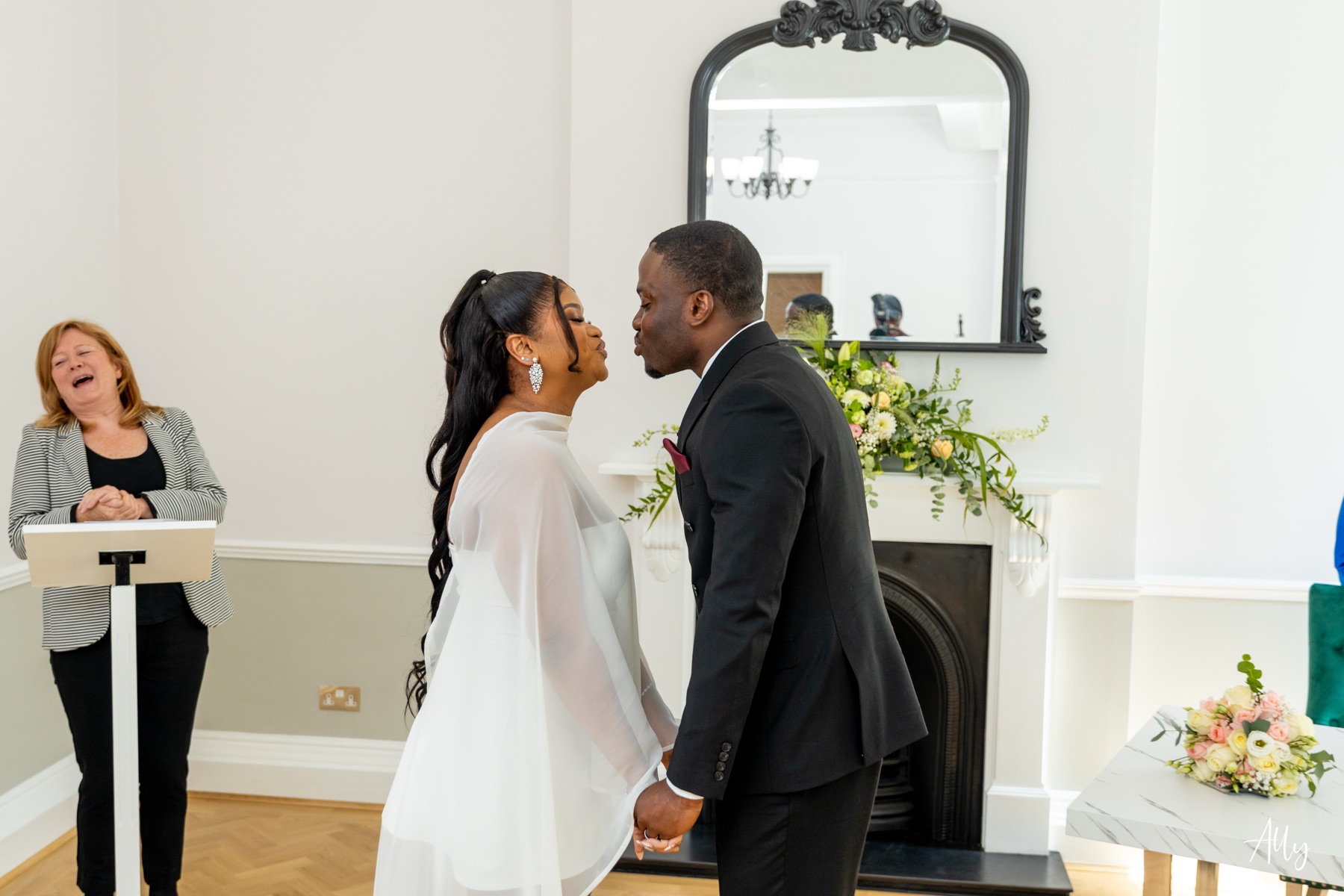 Mercy and Ifeoluwa sharing a kiss during their ceremony