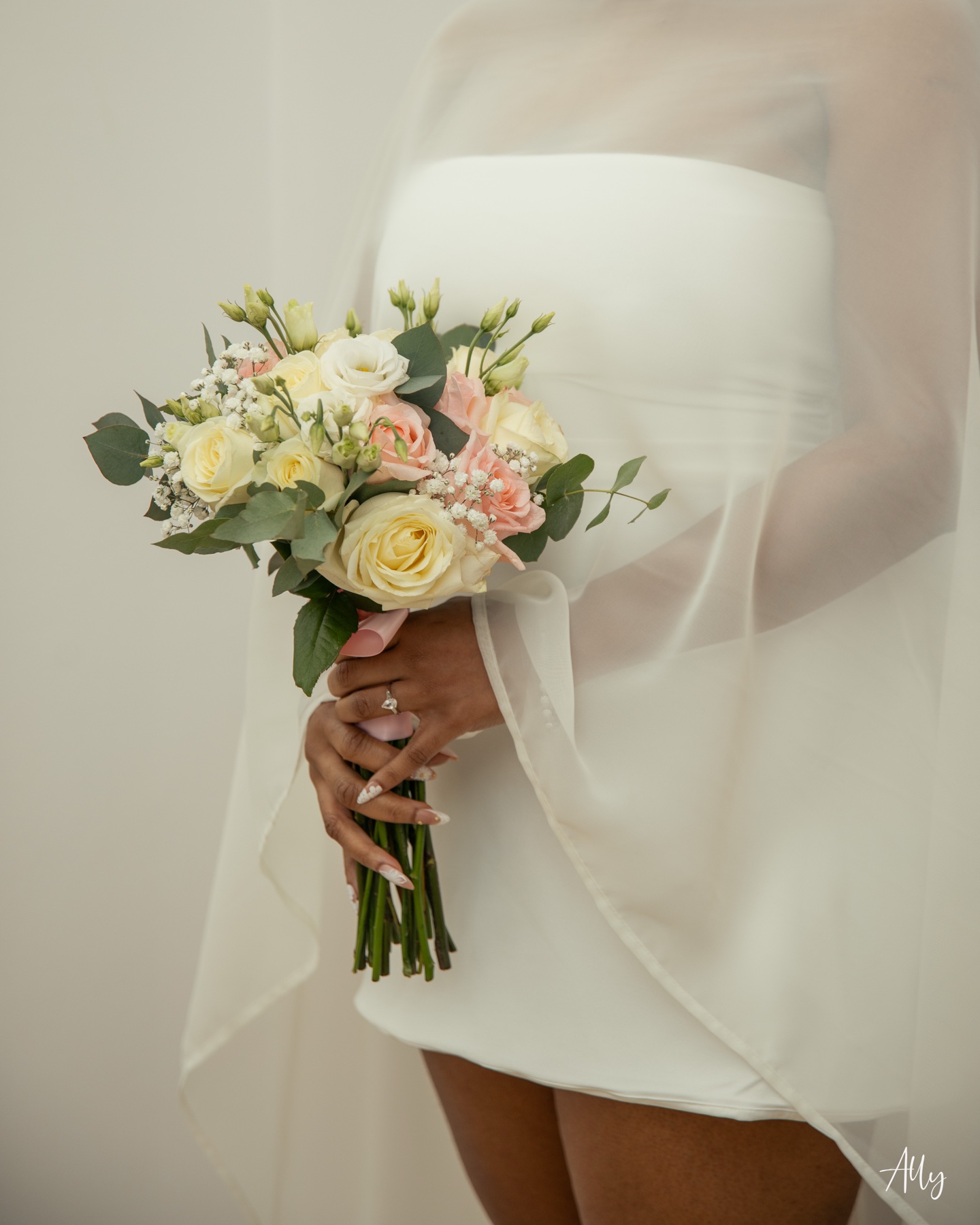 Mercy's bouquet of cream and blush roses